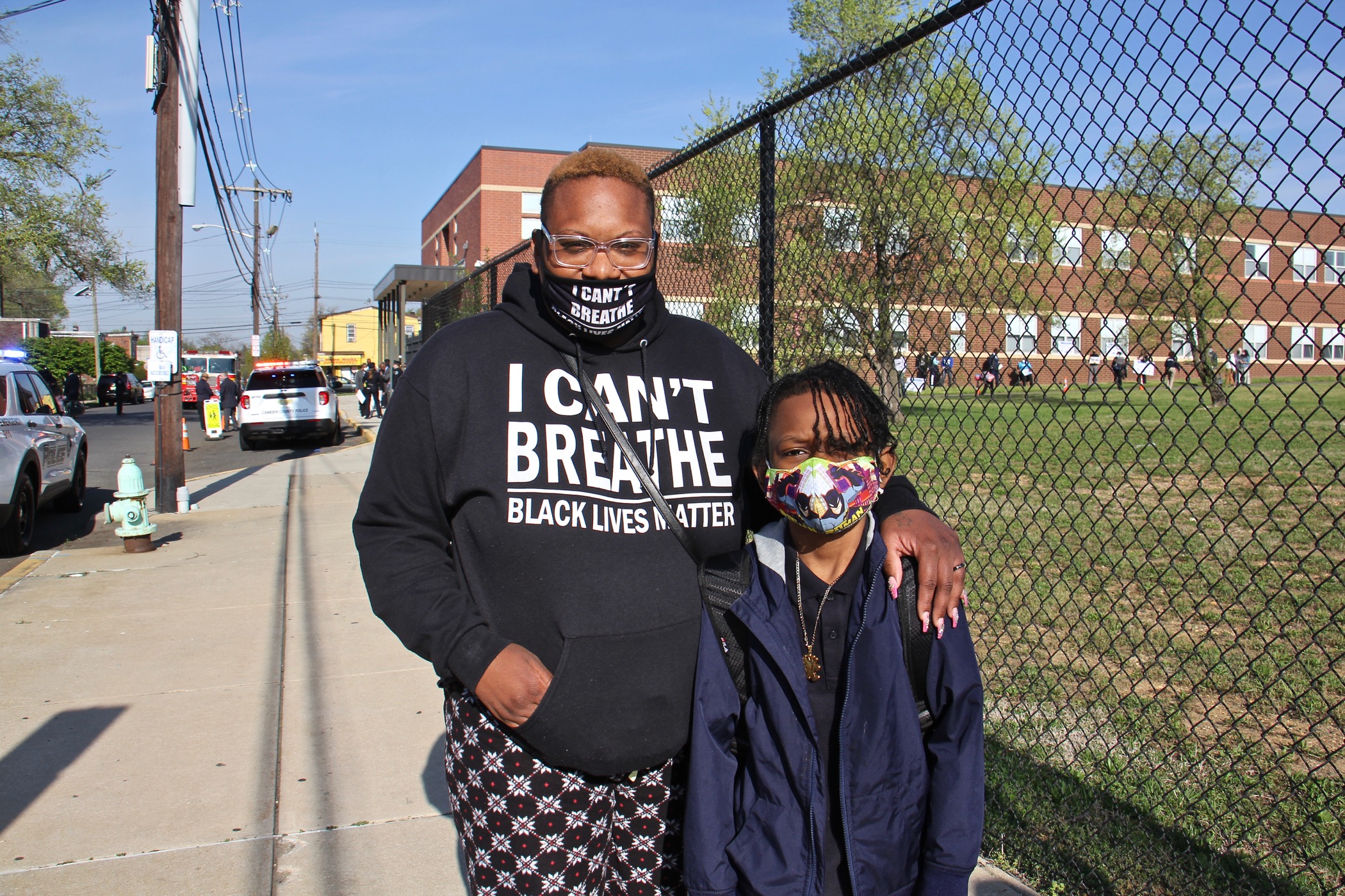 NiG Kinard escorts her son, Keith Kinard III, 8, to opening day