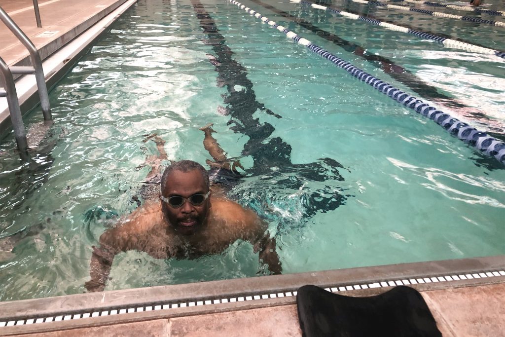 2021-04-22-10.43.40—Copy Omar James Brown has autism. He does his laps in the pool but gets excited most when talking about playing basketball. (Cris Barrish/WHYY)