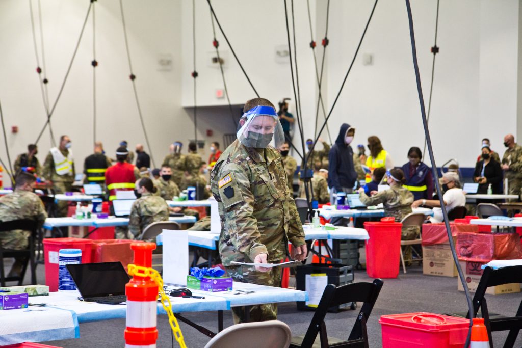 2021-04-9-k-paynter-FEMA-Esperanza-community-vaccinatnion-center-5 Members of the National Guard administer COVID-19 vaccines at the Esperanza Community Vaccination Center in North Philadelphia on April 9, 2021. (Kimberly Paynter/WHYY)