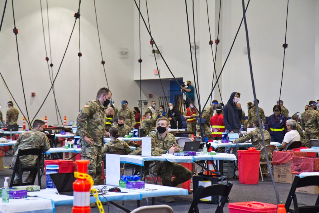 2021-04-9-k-paynter-FEMA-Esperanza-community-vaccinatnion-center-6 Members of the National Guard administer COVID-19 vaccines at the Esperanza Community Vaccination Center in North Philadelphia on April 9, 2021. (Kimberly Paynter/WHYY)
