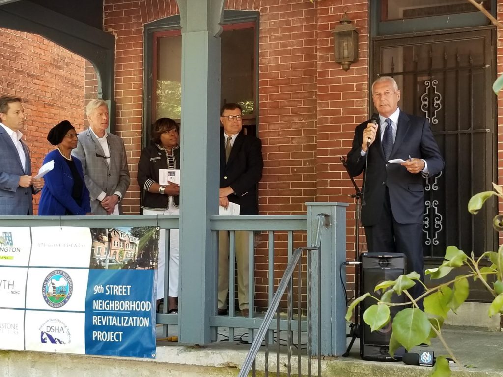 636952641229630000 Bill Freeborn (third from left) observes as Mayor Mike Purzycki talks about a Land Project in Wilmington in 2019.