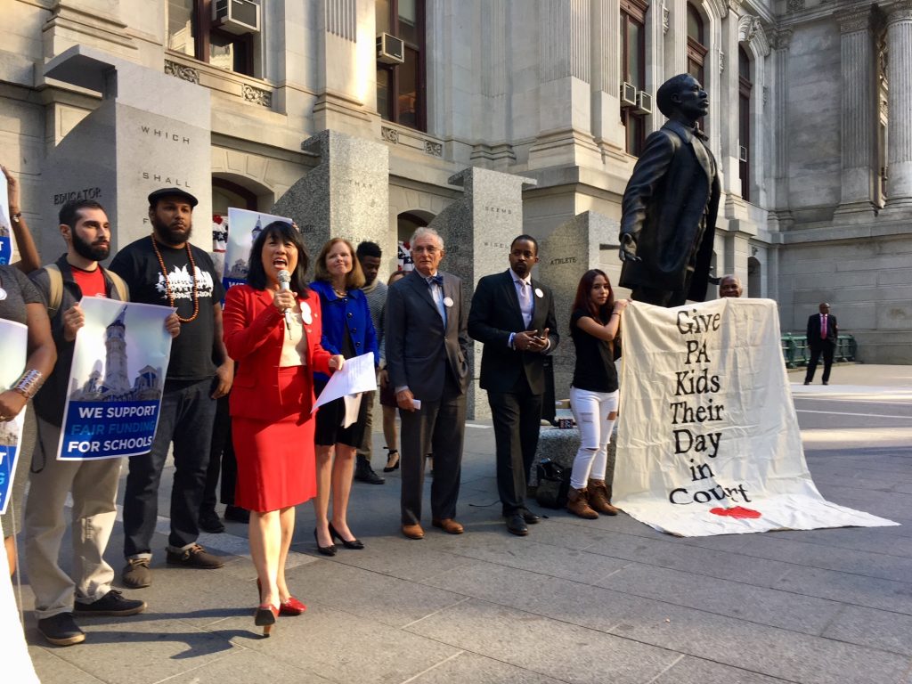 888266707452493051_funding_celebration_pic.0 In 2018, advocates talk to the press outside Philadelphia’s city hall after a court appearance in the fair funding case now scheduled to go to trial in September. (Darryl C. Murphy/The Notebook)