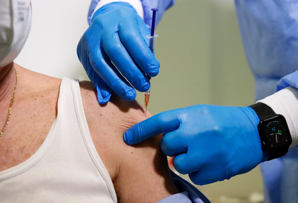Virus Outbreak San Marino Vaccination A man gets the Pfizer COVID-19 vaccine