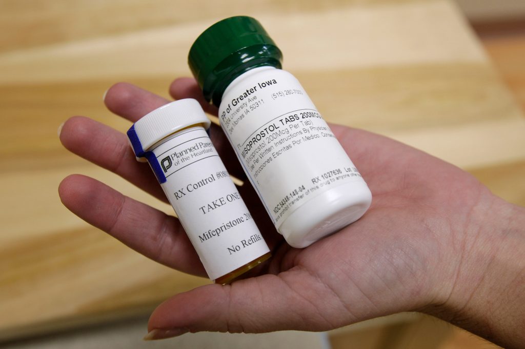 Virus Outbreak Abortion Pill FILE - This Sept. 22, 2010 file photo shows bottles of the abortion-inducing drug RU-486 at a clinic in Des Moines, Iowa. On Tuesday, April 13, 2021, the acting head of the Food and Drug Administration said women seeking an abortion pill will not be required to visit a doctor's office or clinic during the COVID-19 pandemic, in the latest reversal in ongoing legal battles over use of the medication. (AP Photo/Charlie Neibergall)