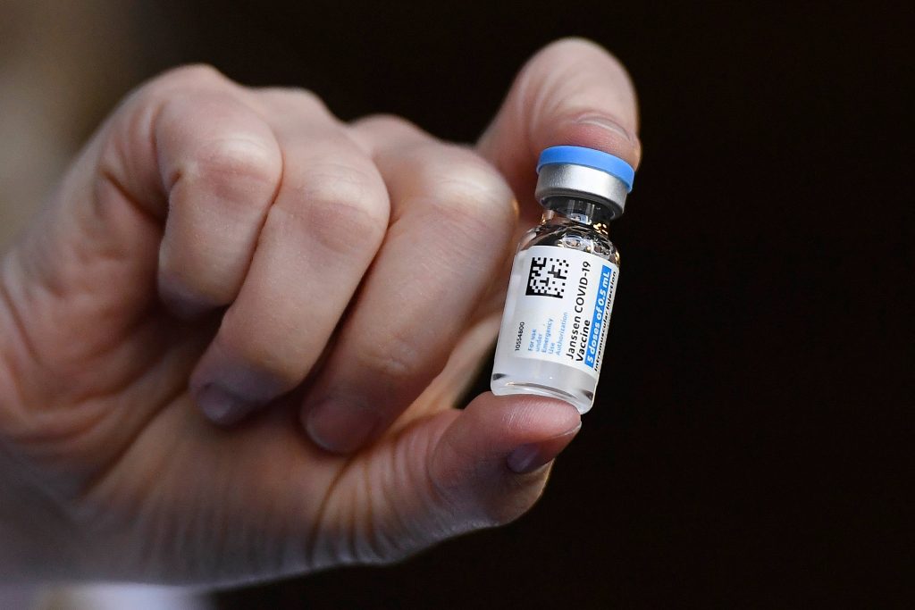 In this March 3, 2021, file photo, the Johnson & Johnson COVID-19 vaccine is held by pharmacist Madeline Acquilano at Hartford Hospital in Hartford, Conn. (AP Photo/Jessica Hill)