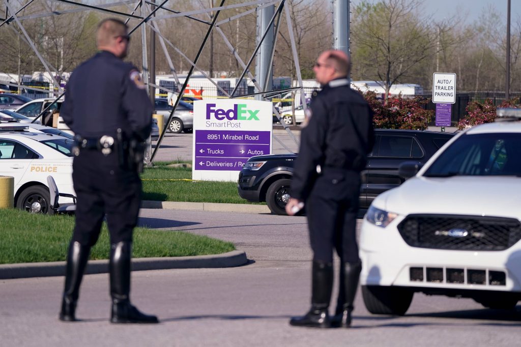 FedEx Shooting Indianapolis Police stand near the scene where multiple people were shot at the FedEx Ground facility early Friday morning, April 16, 2021, in Indianapolis. A gunman killed eight people and wounded several others before apparently taking his own life in a late-night attack at a FedEx facility near the Indianapolis airport, police said, in the latest in a spate of mass shootings in the United States after a relative lull during the pandemic. (AP Photo/Michael Conroy)