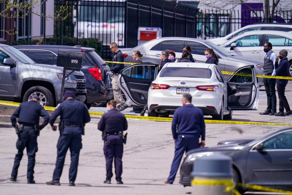 FedEx Shooting Indianapolis Law enforcement confer at the scene, Friday, April 16, 2021, in Indianapolis, where multiple people were shot at a FedEx Ground facility near the Indianapolis airport. (AP Photo/Michael Conroy)