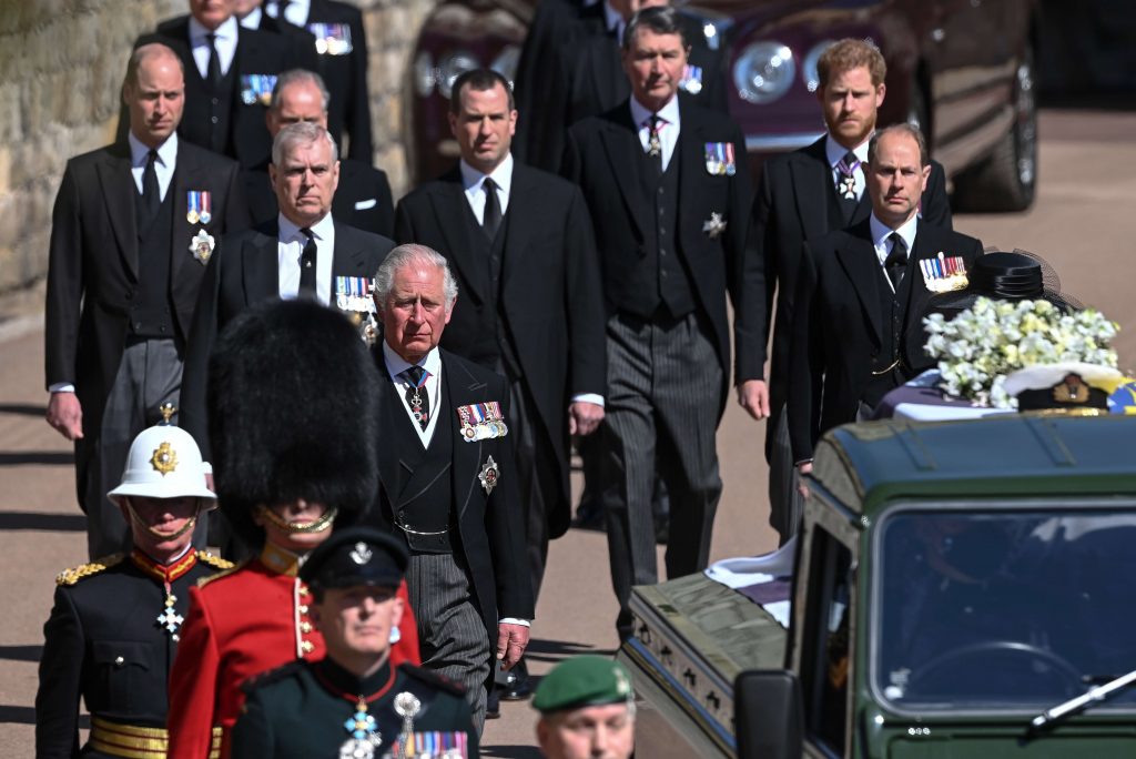 APTOPIX Britain Prince Philip Funeral From front left, Britain's Prince Charles, Prince Andrew. Prince Edward, Prince William, Peter Phillips, Prince Harry, Earl of Snowdon and Tim Laurence follow the coffin the coffin makes it's way past the Round Tower during the funeral of Britain's Prince Philip inside Windsor Castle in Windsor, England Saturday April 17, 2021. (Leon Neal/Pool via AP)