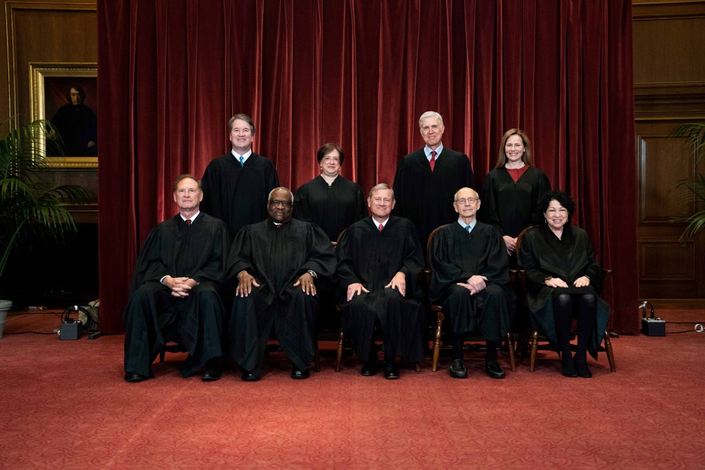 Supreme Court Student Speech In this April 23, 2021, file photo members of the Supreme Court pose for a group photo at the Supreme Court in Washington. Seated from left are Associate Justice Samuel Alito, Associate Justice Clarence Thomas, Chief Justice John Roberts, Associate Justice Stephen Breyer and Associate Justice Sonia Sotomayor, Standing from left are Associate Justice Brett Kavanaugh, Associate Justice Elena Kagan, Associate Justice Neil Gorsuch and Associate Justice Amy Coney Barrett. Before the Supreme Court this is week is an argument over whether public schools can discipline students over something they say off-campus. (Erin Schaff/The New York Times via AP, Pool, File)