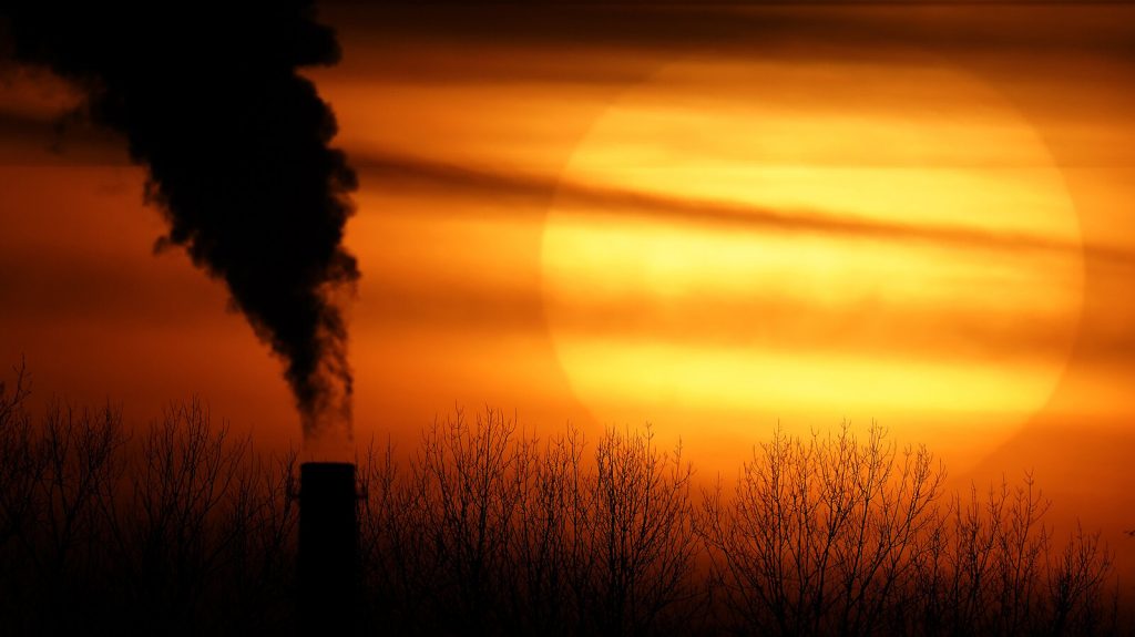 Europe US Climate Emissions from a coal-fired power plant are silhouetted against the setting sun