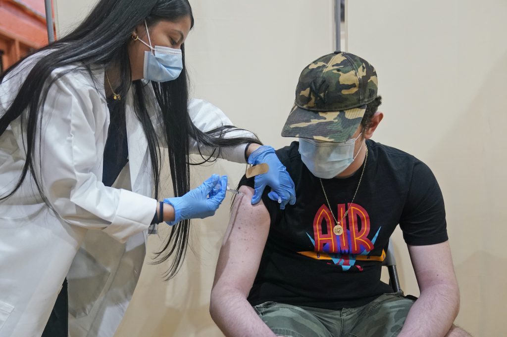 Virus Outbreak New Jersey Vaccine Alejandro Garcia, 16, receives his first dose of the Pfizer COVID-19 vaccine
