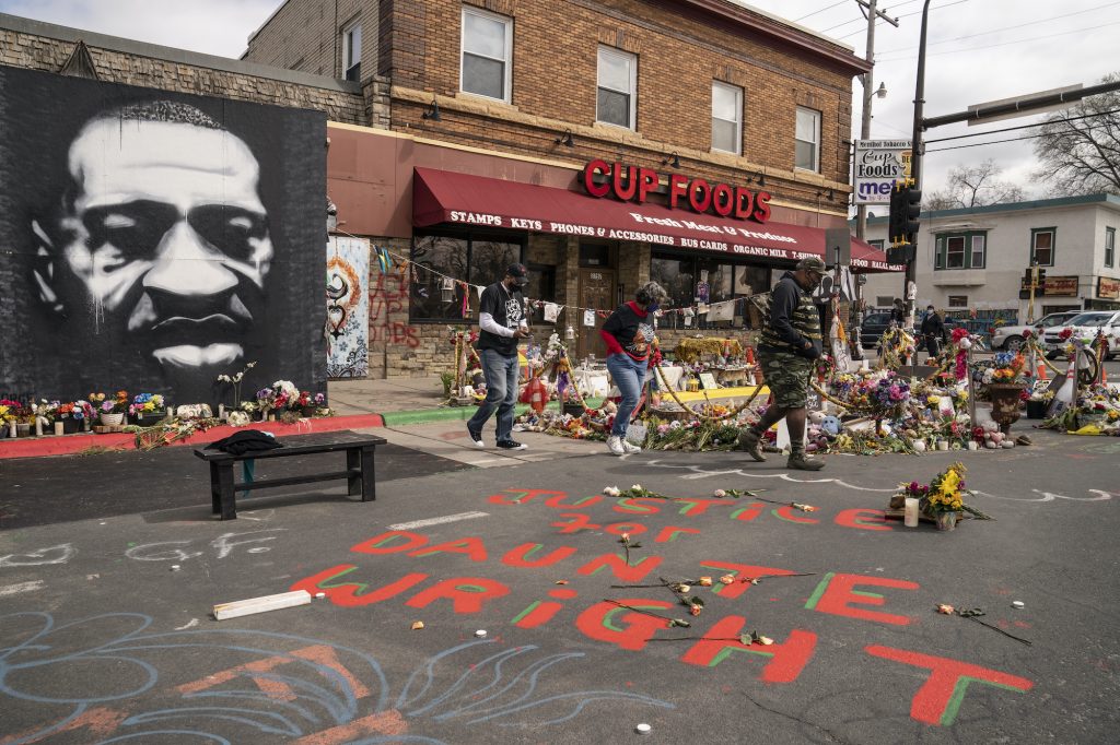 Police Shooting Minnesota Visitors view a memorial to George Floyd as a new addition commemorating Daunte Wright is displayed outside Cup Foods