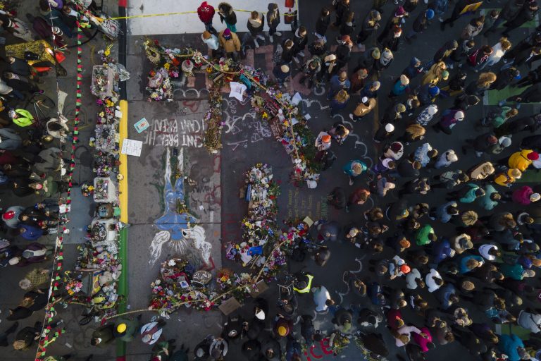 A crowd gathers next to the spot where George Floyd was murdered at George Floyd Square after a guilty verdict was announced at the trial of former Minneapolis police Officer Derek Chauvin