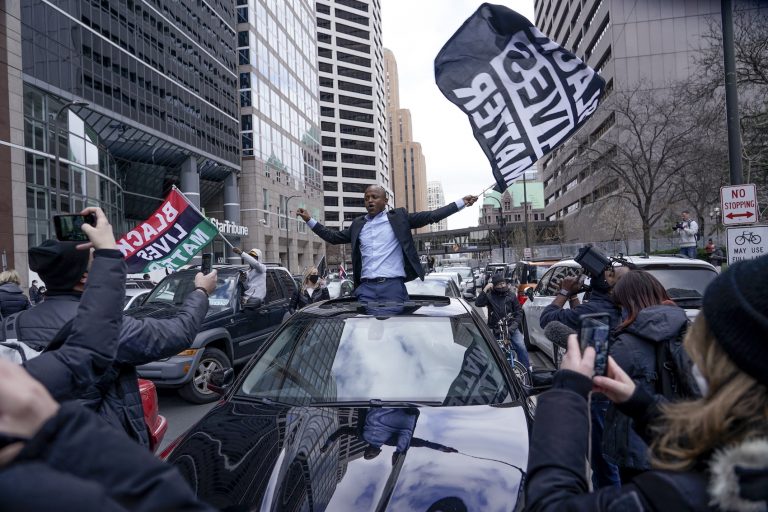 People rally outside the courthouse in Minneapolis