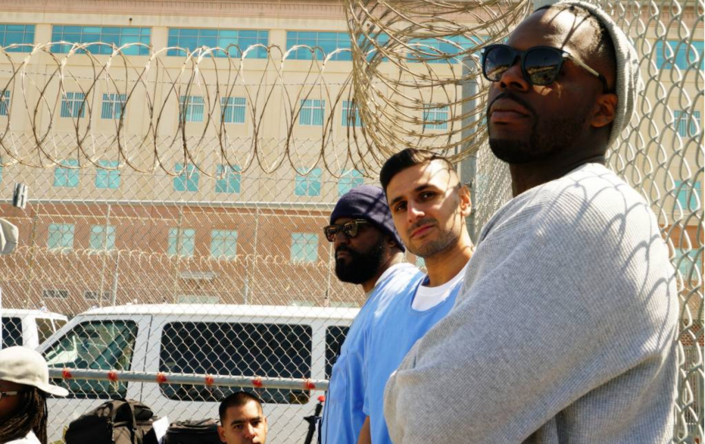 Adnan-Khan-at-San-Quentin Adnan Khan (middle) spent 16 years of his life in California prisons until he was released in 2019 under a re-sentencing bill he helped create while behind bars. Now he's an advocate on behalf of incarcerated people. (Courtesy of Adnan Khan)