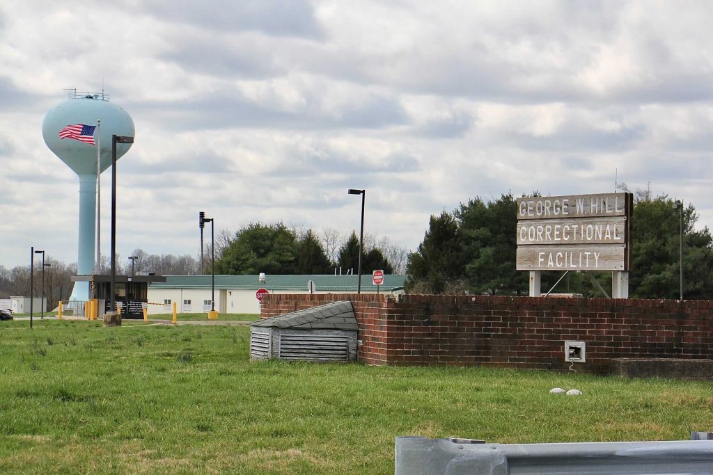 Image from iOS (83) A view of a sign for a correctional facility.