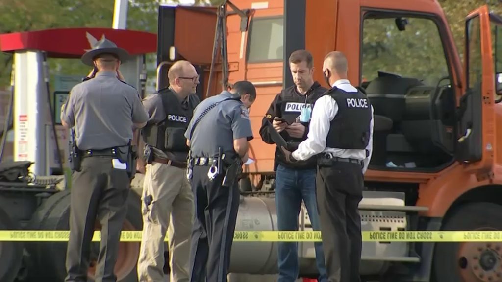 Police-Wawa-Parking-Lot-Truck Law enforcement gathers outside a Wawa, where a gunman fired at a man pumping gas
