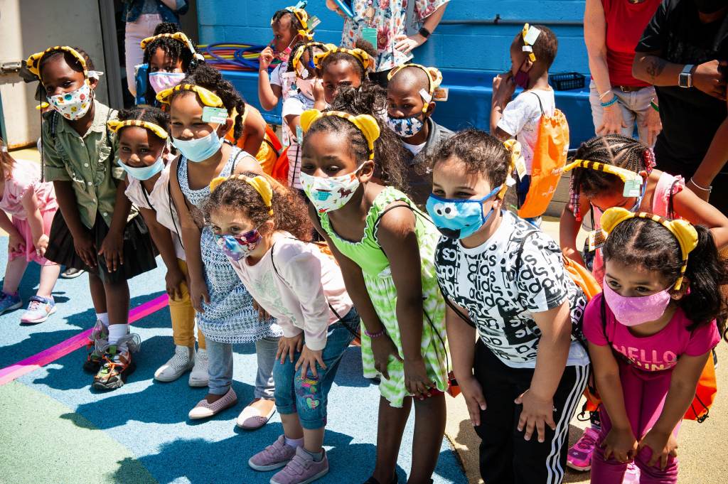 A group of kids with masks on