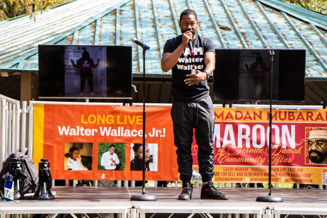 Jon McKay, founder of Life Outside the Streets, talks to the crowd about mental health in communities at Malcolm X Park