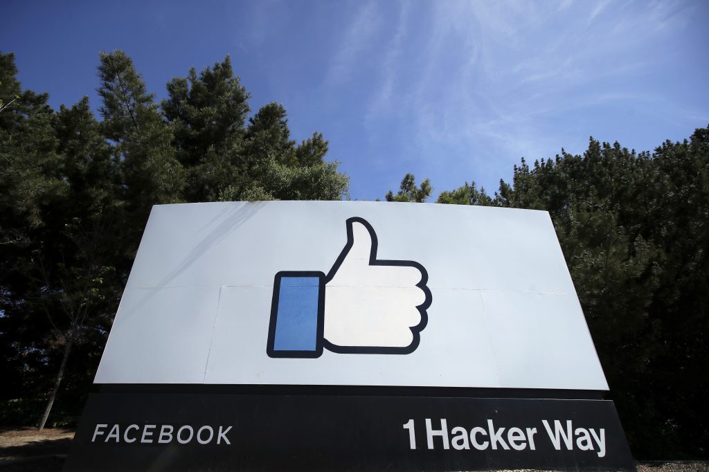 The group Muslim Advocates on Thursday sued Facebook for allegedly making false statements about taking down hateful and violent content that violates its community guidelines. the thumbs up Like logo is shown on a sign at Facebook headquarters in Menlo Park, Calif.