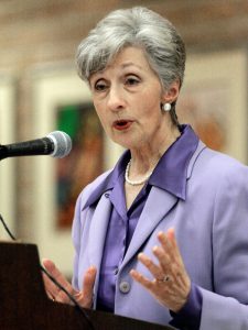 Doris Meissner speaks from a podium