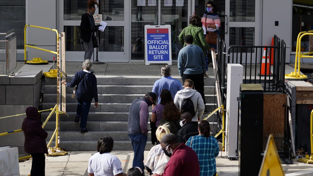 Residents line up outside the Montgomery County voter services office in October in Norristown, Pa. Last year, Joe Biden ran up the vote margins in the collar counties of Philadelphia, including Montgomery. Residents line up outside the Montgomery County, Pa., Voter Services office, Monday, Oct. 19, 2020, in Norristown, Pa. Monday is the last day in Pennsylvania to register to vote in the Nov. 3 election in which the presidential battleground state is playing a central role in the contest between President Donald Trump and former Vice President Joe Biden. (AP Photo/Matt Slocum)