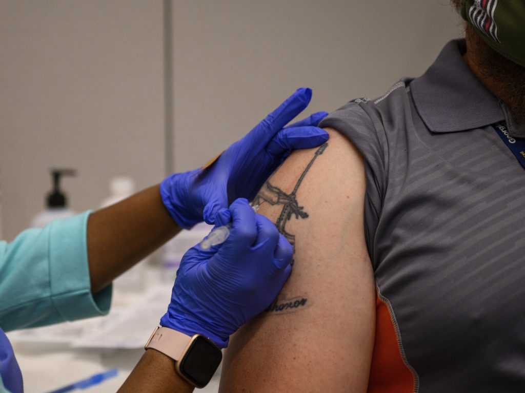 Virus Outbreak College Vaccines Adam Jackson receives a Pfizer COVID-19 vaccination