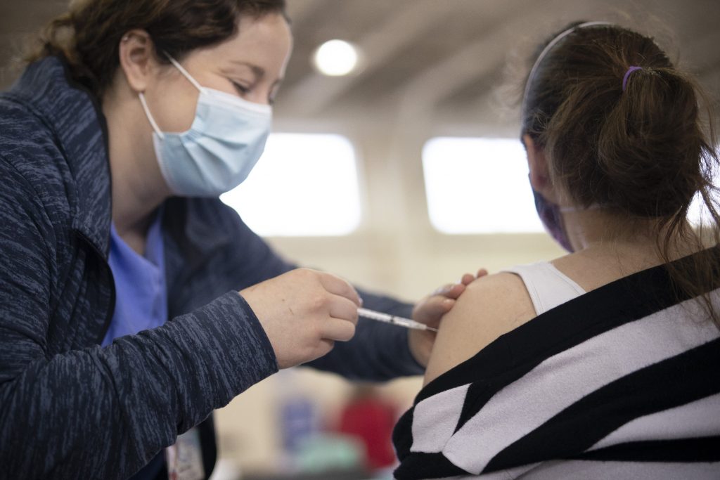 Gov. Wolf Visits Penn State Health Vaccination Clinic, Discusses Vaccine Rollout Progress, Encourages Everyone to Get Vaccinated A member of Penn State Health's vaccination clinic staff administers a dose of the COVID-19 vaccine.
