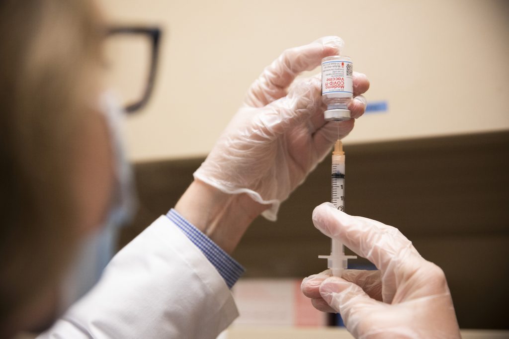 Gov. Wolf Recognizes Grocery Store Workers, Now Vaccine Eligible, for Heroic Work A pharmacist fills a syringe with COVID-19 vaccine