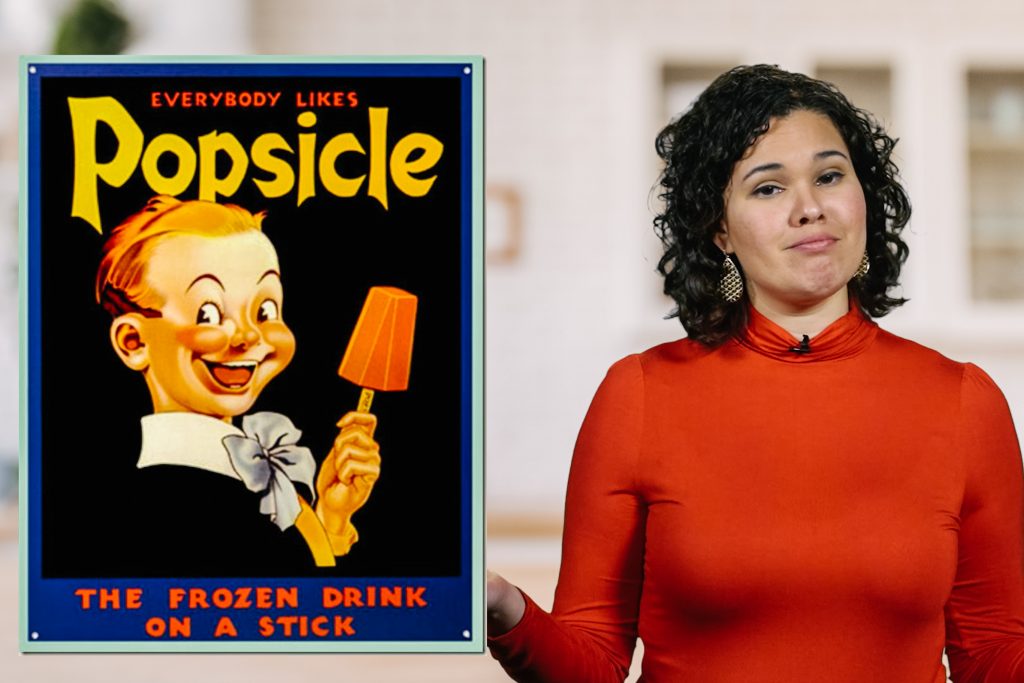delishtory-web-4×6 Kae Lani Palmisano next to a popsicle poster in Delishtory: Accidental Food Inventions