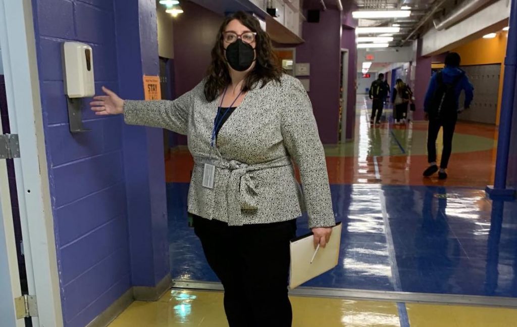179025448_758741321491176_3667757264240026577_n.0 Margaux Munnelly, principal Mastery Charter School-Pickett Campus in Germantown, uses the hand sanitizer station in the hallway. (Dale Mezzacappa/Chalkbeat Philadelphia)