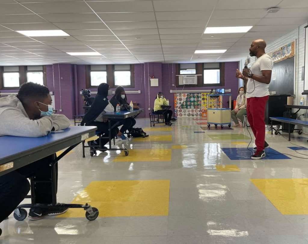 185993978_145499767506211_5090509326068079221_n.0 Kamau Stanford, chief operating officer for the Philadelphia Black Doctors COVID-19 Consortium, speaks to students at Mastery Charter School’s Shoemaker campus Friday. (Johann Calhoun/Chalkbeat)