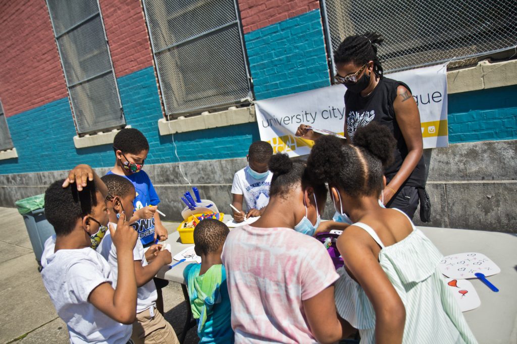 2021 05 19 k paynteranti-violence rally southwest philadelphia-3 Mitchell Elementary School students color fans at an anti-violence rally and resource fair in Southwest Philadelphia on May 19, 2021. (Kimberly Paynter/WHYY)