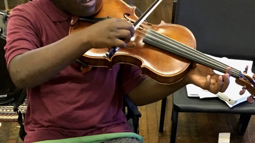 2021 05 19-provided-philadelphia arts in education partnership-district attorney diversion A student practices violin as part of the Philadelphia Arts in Education Partnership. The PAEP has partnered with the DA’s office to divert youth offenders into its arts classes. (Courtesey of PAEP)