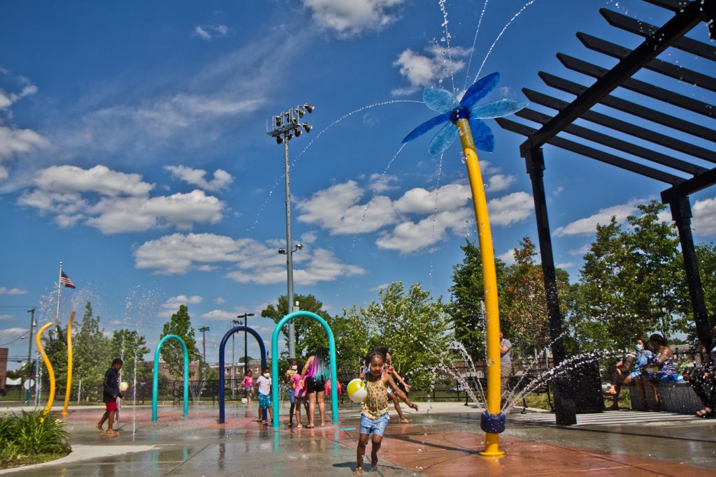 2021-05-27-k-paynter-spreaygrounds-open-finley-recreation-center-9 Elated children at Finley Recreation Center in Philadelphia run through the sprayground on the first day of operation, May 27, 2021. (Kimberly Paynter/WHYY)