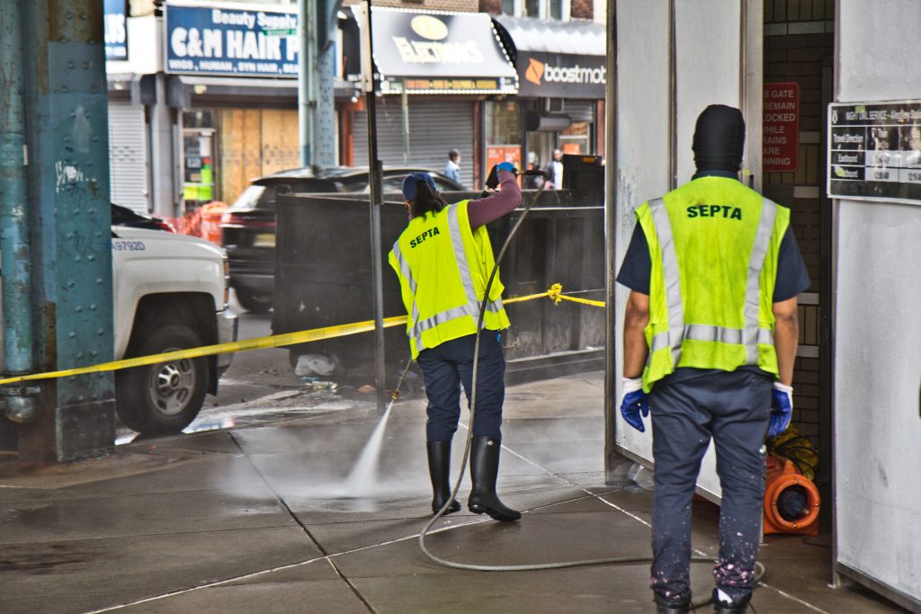 2021-05-6-k-paynter-kensington-ave-walk-with-social-workers-14 SEPTA workers power wash Allegheny Station on Kensington Avenue. (Kimberly Paynter/WHYY)