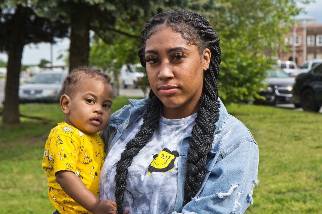 2021 05 7 k paynter CFCF protest-3 Asia Pratt holds her son Azi, while protesting conditions for people who are incarcerated at the Curran-Fromhold Correctional Facility in Northeast Philadelphia on May 7, 2021. (Kimberly Paynter/WHYY)