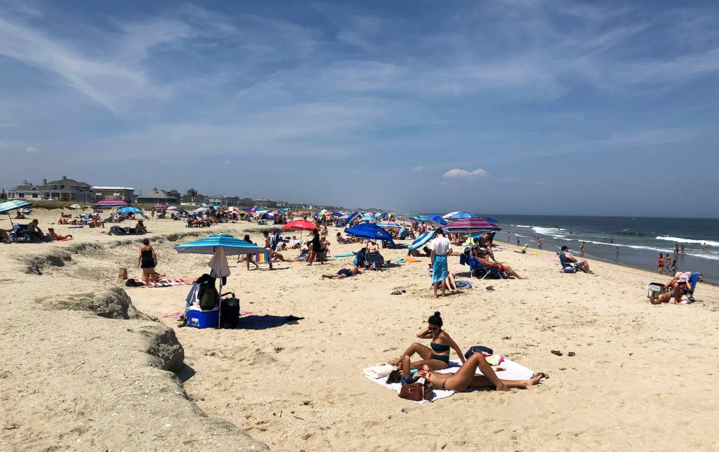 Virus Outbreak New Jersey Daily Life Beachgoers spend time at Monmouth Beach, N.J., Sunday, July 5, 2020. (AP Photo/Eric Carvin)