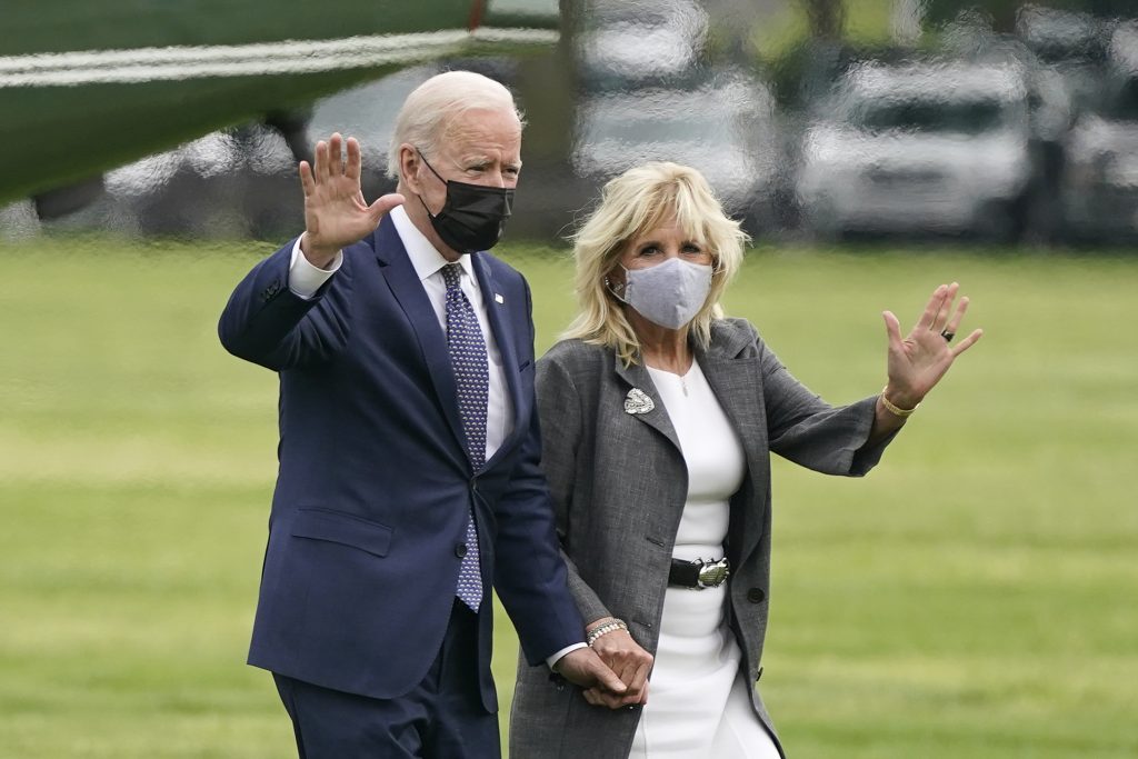 President Joe Biden and first lady Jill Biden wave after stepping off Marine One on the Ellipse near the White House, Monday, May 3, 2021, in Washington. The Biden's traveled Monday to coastal Virginia to promote his plans to increase spending on education and children, part of his $1.8 trillion families proposal announced last week.