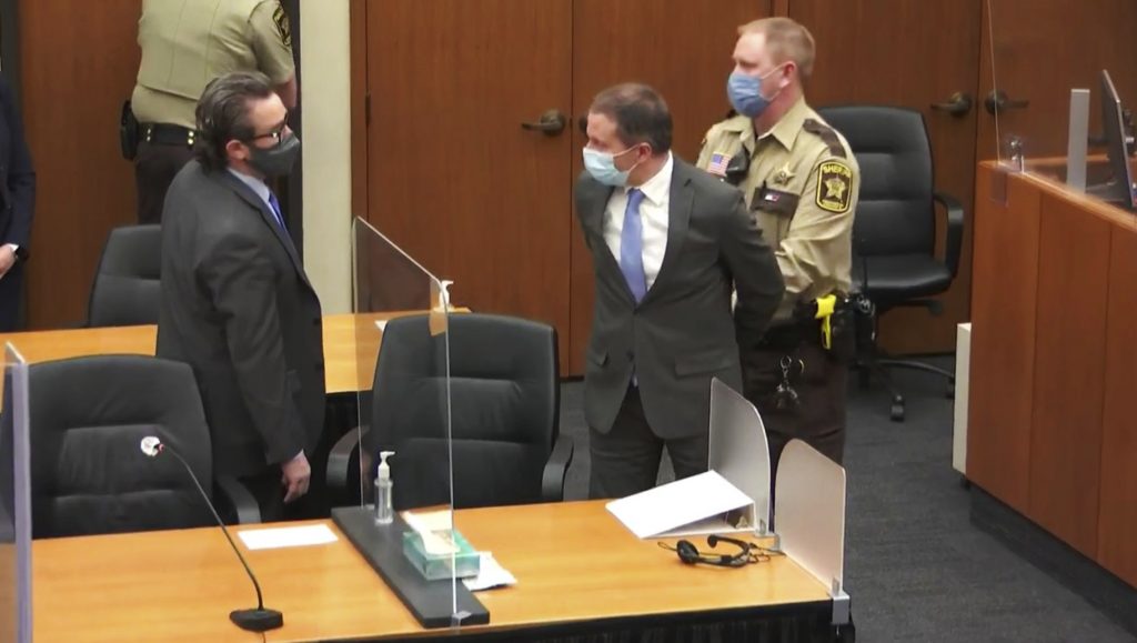 In this April 20, 2021 file image from video, former Minneapolis police Officer Derek Chauvin, center, is taken into custody as his attorney, Eric Nelson, left, looks on, after the verdicts were read at Chauvin's trial for the 2020 death of George Floyd,, at the Hennepin County Courthouse in Minneapolis, Minn. Nelson has requested a new trial, saying the court abused its discretion when it refused to change the venue in the original proceedings, according to a court document filed Tuesday, May 4, 2021. (Court TV via AP, Pool, File)