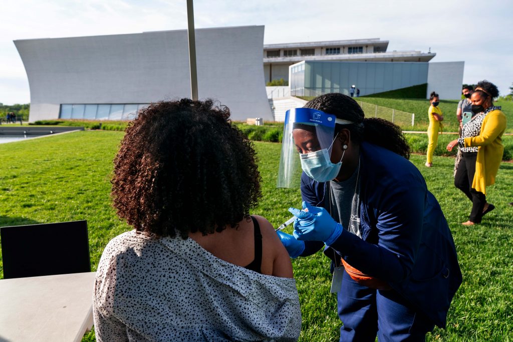Kendria Brown In this May 6, 2021, file photo, Kendria Brown, a nurse with DC health, vaccinates a woman with the Johnson & Johnson COVID-19 vaccine at The REACH at the Kennedy Center in Washington. (AP Photo/Jacquelyn Martin, File)