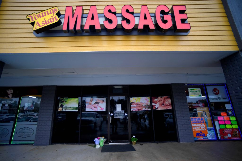 Massage Business Shootings In this Wednesday, March 17, 2021 file photo, A make-shift memorial is seen outside a business where a multiple fatal shooting occurred on Tuesday, in Acworth, Ga. (AP Photo/Mike Stewart)