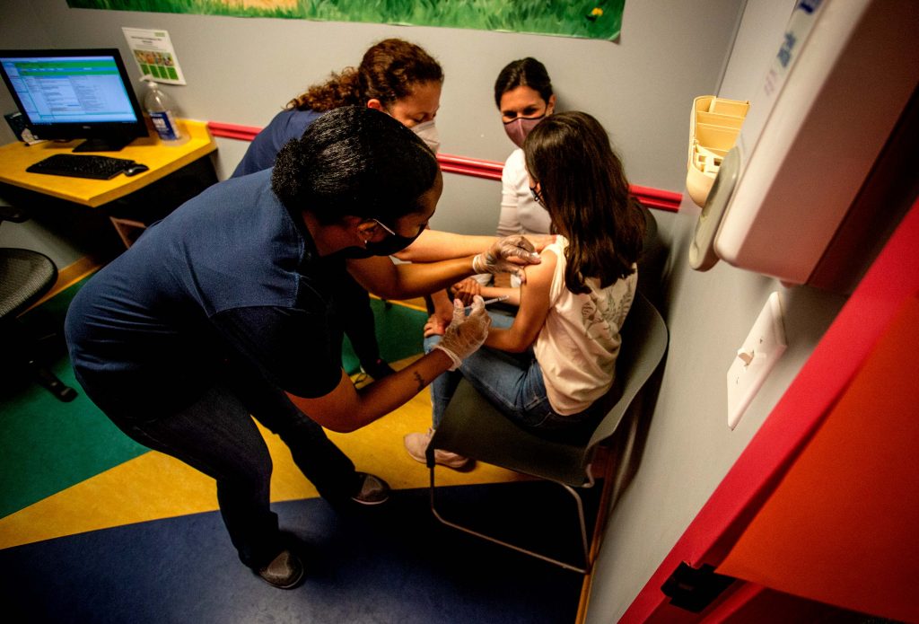 US Virus Child Vaccinations Middle school student Elise Robinson receives her first coronavirus vaccination on Wednesday, May 12, 2021, in Decatur, Ga. (AP Photo/Ron Harris)