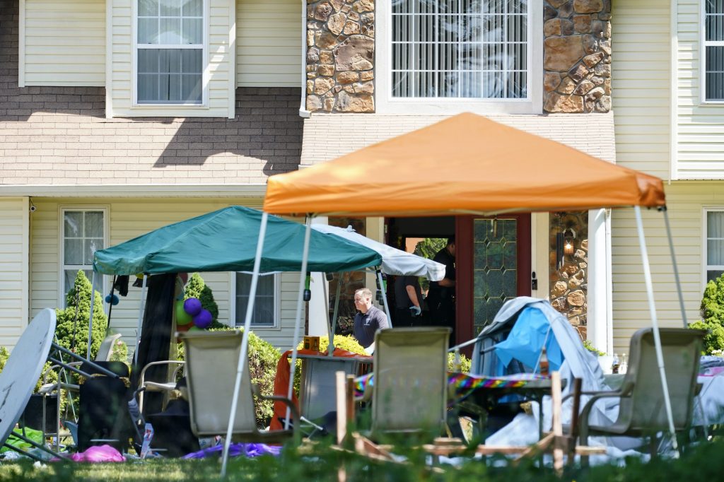 Shooting New Jersey Party tents and decorations are askew in front of a Fairfield Twp. home