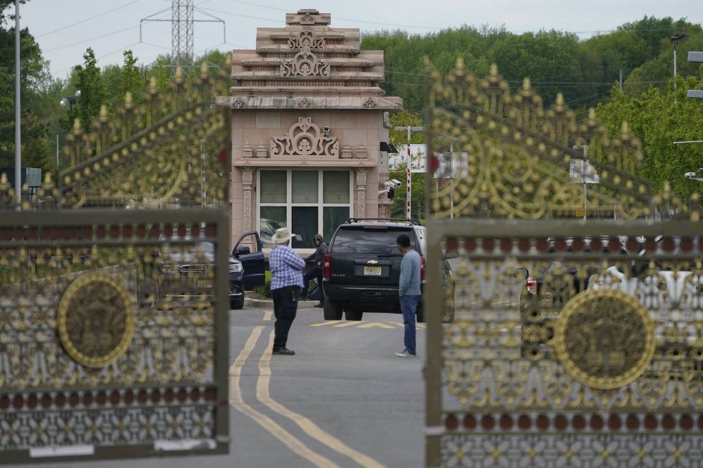 Hindu Temple Human Trafficking People stand near the entrance to the BAPS Shri Swaminarayan Mandir in Robbinsville Township