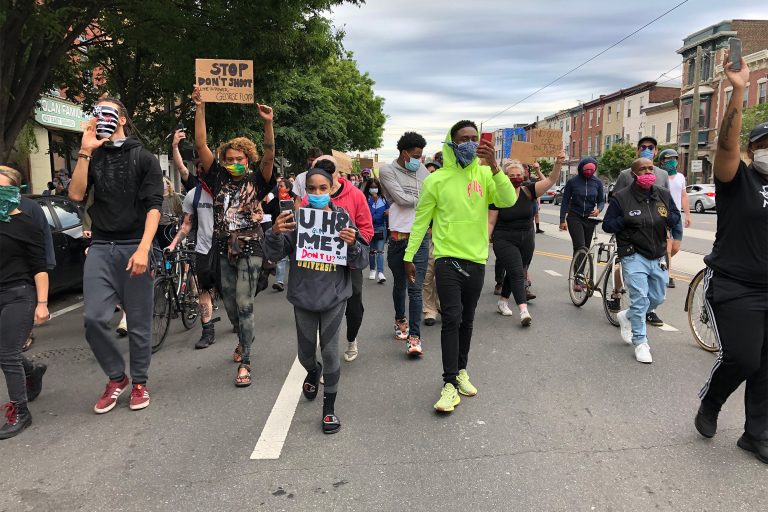 Black Lives Matter protesters led by Romel Clark (center) march through Fishtown on June 2, 2020. (Layla A. Jones/WHYY)