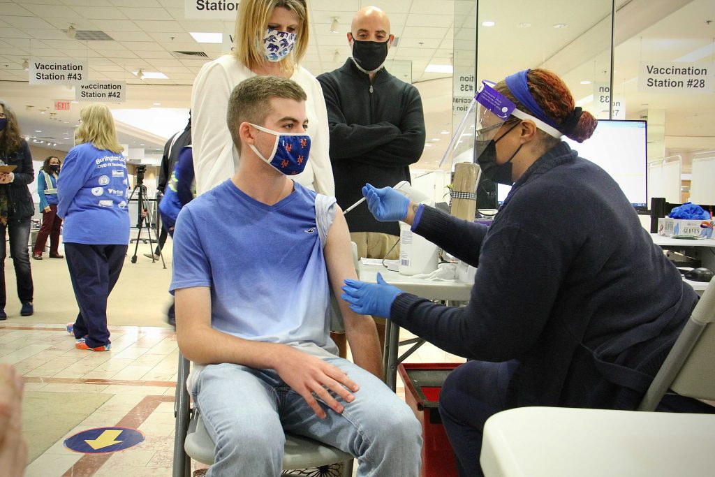 Image from iOS Donald Cucuzzella receives a COVID-19 vaccine