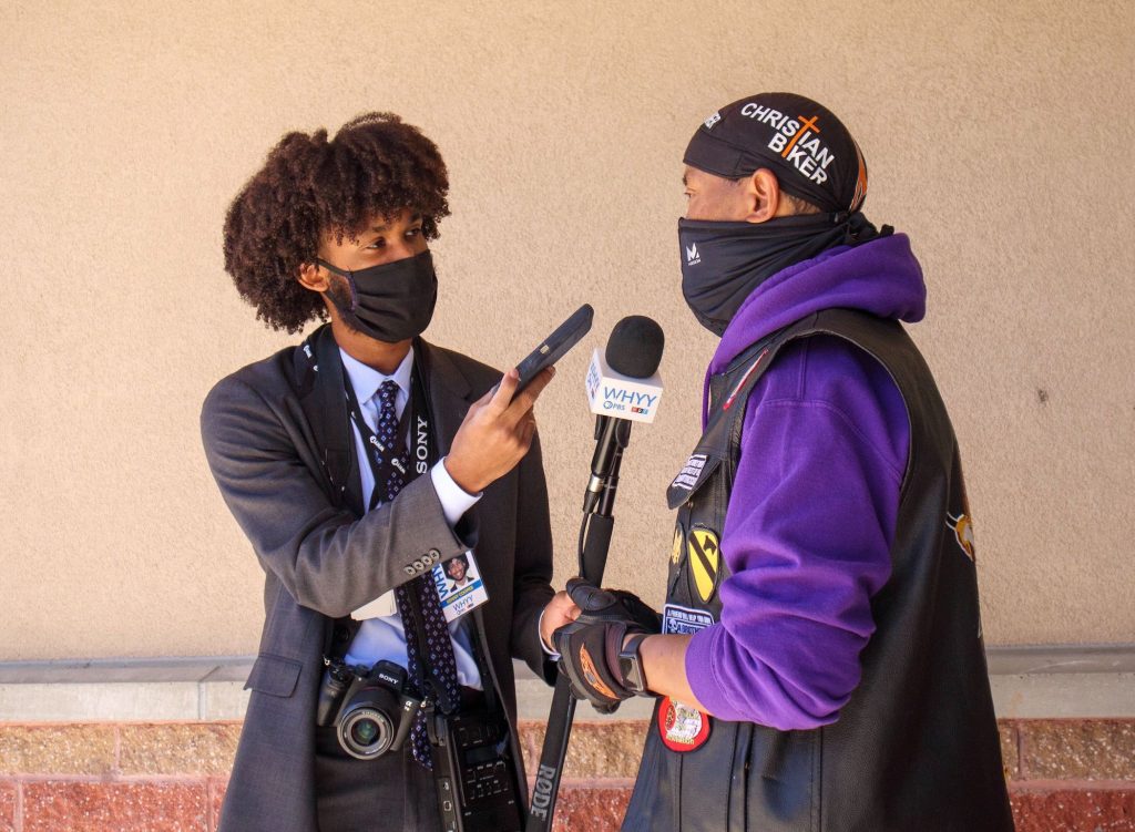 Image from iOS (195) WHYY's suburban reporter Kenny Cooper conducts an interview. (Langston Collins)