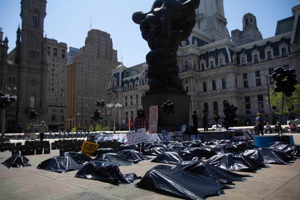 OSOC_rally_KP_051121_02 Rosalind Pichardo stands amid body bags during a rally