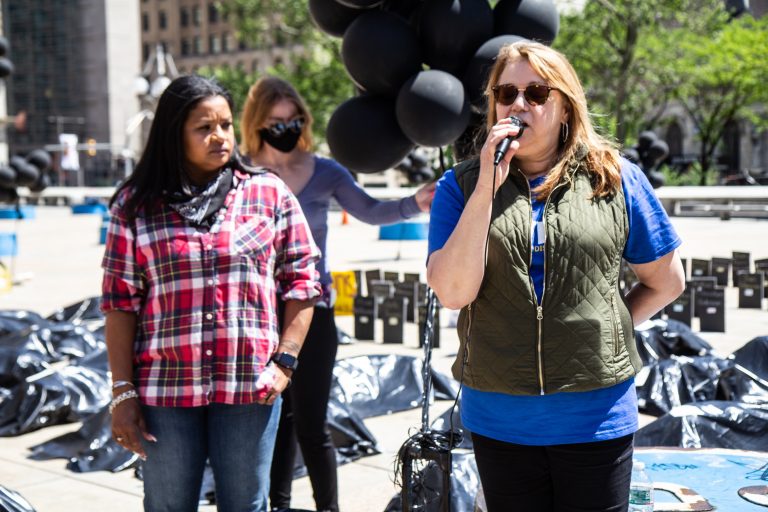 Rosalind Pichardo and Aleida Garcia stand at a rally